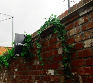 Restaurant Sign with Greenery